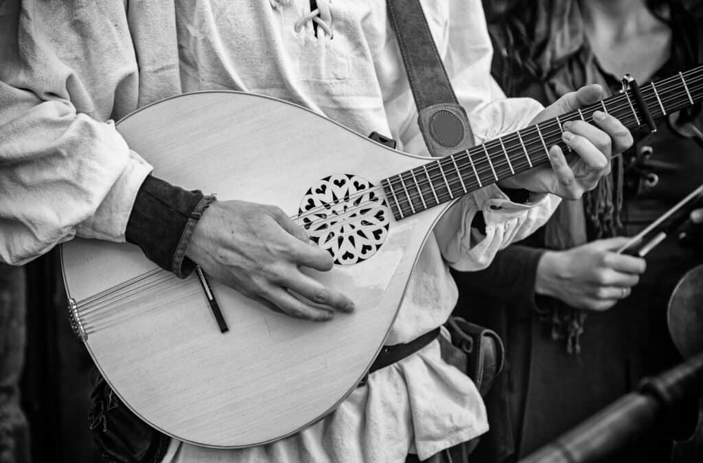 bard strumming guitar