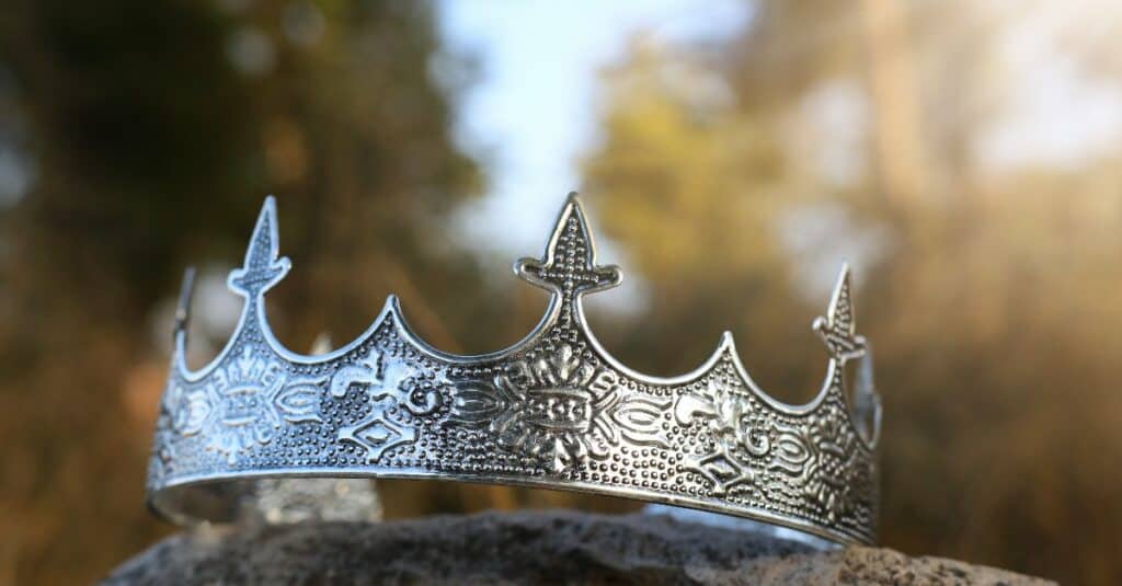 Silver king's crown on stone