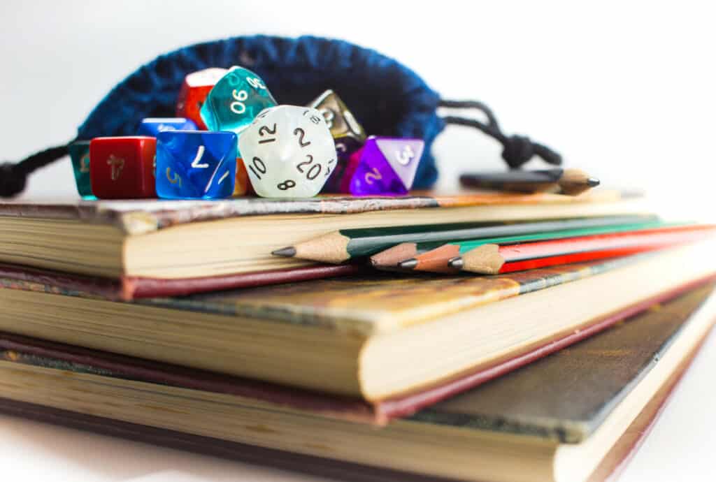 dnd dice on top of books
